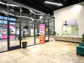 Glass interiors at the C21+ Hemet dispensary